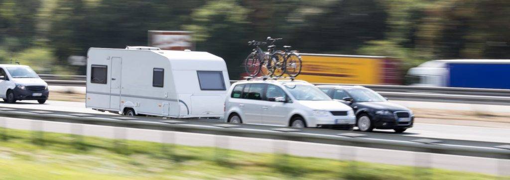 Car and caravan on motorway