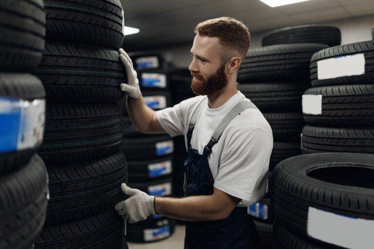 man choosing tyre